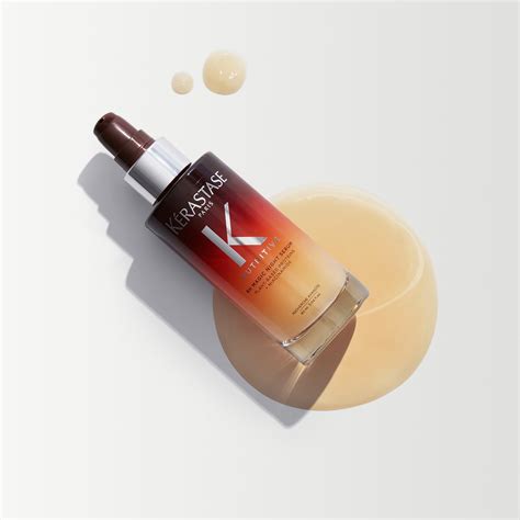 A close-up shot of the Kérastase 8H Magic Night Serum bottle, highlighting its glass packaging.