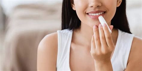 Visual representation of applying lip balm before bed.