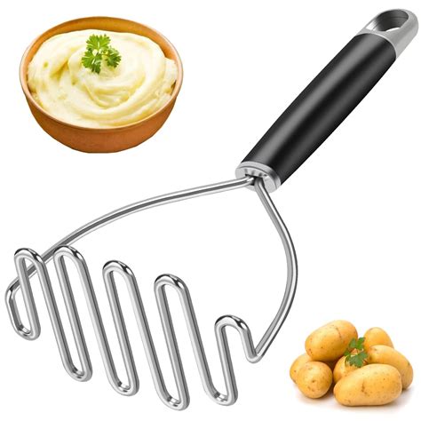 Photo of mashed potatoes being mashed with a potato masher in a bowl.