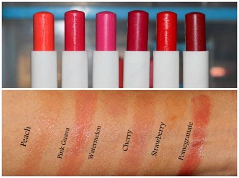 Swatches of Nivea Fruity Shine lip balm in Strawberry and Pomegranate shades on the arm, showing the color difference