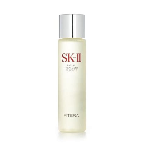 A bottle of SK-II Facial Treatment Essence with its distinctive packaging, placed on a clean surface.