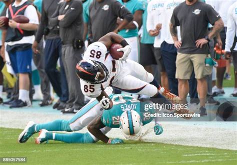 Reshad Jones making a tackle during an NFL game for the Miami Dolphins.