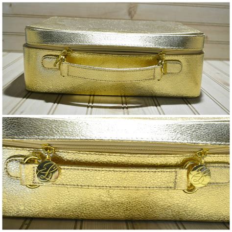 Vintage Estee Lauder gold cosmetic travel case with matching mirror and makeup bag