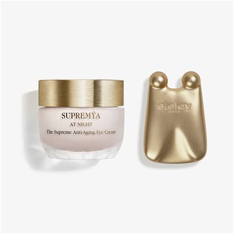 Close-up of the Sisley Supremya Eye Cream packaging, highlighting the applicator tool