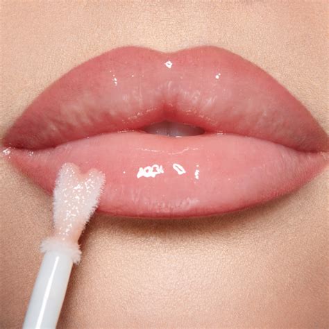 Close-up of lips with a shiny, hydrating lip gloss, highlighting a pleasant texture and subtle sheen.