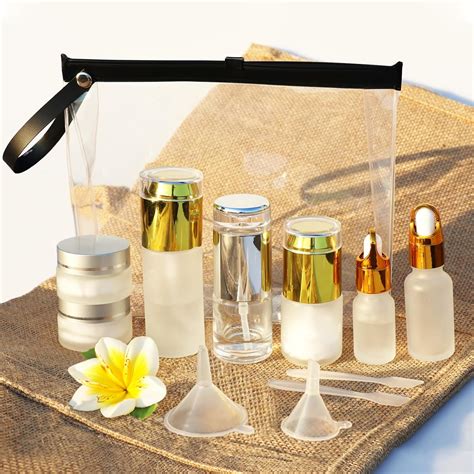 A collection of small, clear, refillable travel-size bottles and reusable makeup containers.