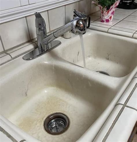 A pristine kitchen sink after being cleaned with Bar Keepers Friend