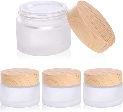 A variety of empty cosmetic containers in glass, plastic, and metal