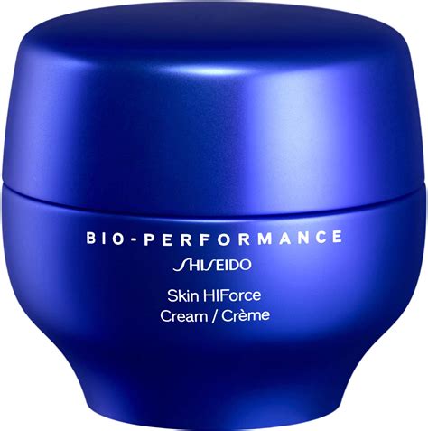 Close-up shot of the Shiseido Bio-Performance Cream's rich, custard-like texture on fingertips.