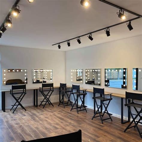 Interior of a professional makeup studio with lighting and mirrors