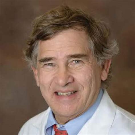 Portrait of Dr. Gerald N. Goldberg, a distinguished dermatologist.