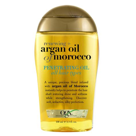 Bottle of argan oil with a backdrop of Moroccan landscape