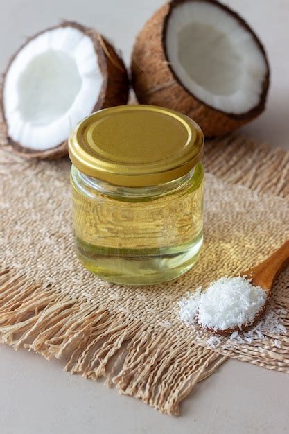 Coconut oil in a jar with fresh coconuts