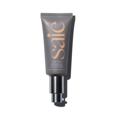 Top view of the Saie Slip Tint bottle with its cap removed, showing the creamy texture of the tinted moisturizer.