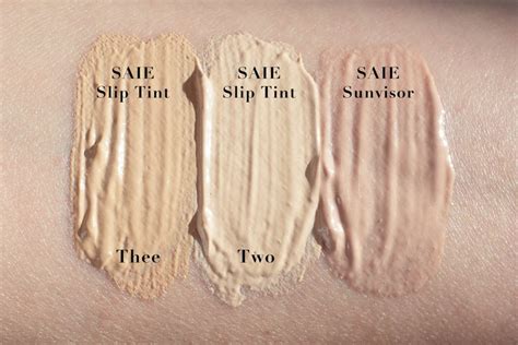 Comparison swatches of Saie Slip Tint, Saie Sunvisor, and Ilia Super Serum Skin Tint on different skin tones.