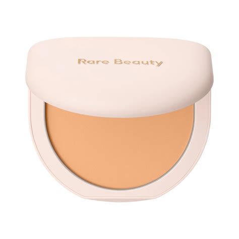 An arrangement of the Rare Beauty loose setting powder alongside the tinted pressed finishing powder.