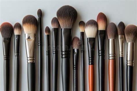 A collection of various makeup brushes, showcasing different shapes and bristle types.