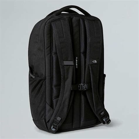 A clean North Face backpack hanging upside down to air dry.