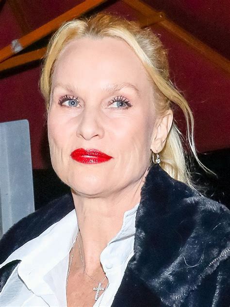 A split-screen image comparing Dolly Parton to actress Nicollette Sheridan, illustrating a case of mistaken identity.