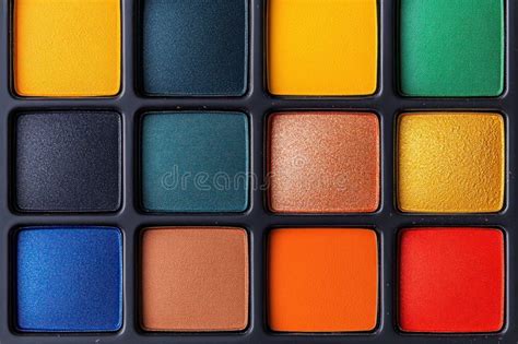 A close-up of a glam eyeshadow palette with vibrant, shimmery shades.