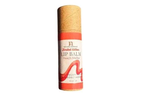 Photo of Nirvana Natural Peach Melba limited edition eco-friendly lip balm in a metal tin.