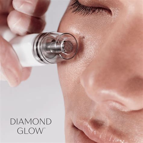 Image of a DiamondGlow facial device and its different treatment tips.