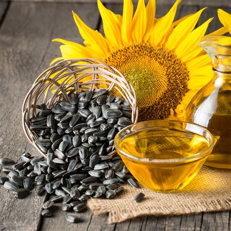 Close-up photo of sunflower seeds and oil, highlighting its natural origin.