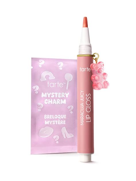 Product packaging with the Tarte Maracuja Juicy Lip Plumping Gloss and a collection of mystery charms.