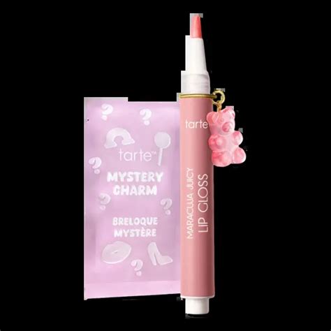 Close-up of the Tarte Maracuja Juicy Lip Plumping Gloss applicator and charm attachment.