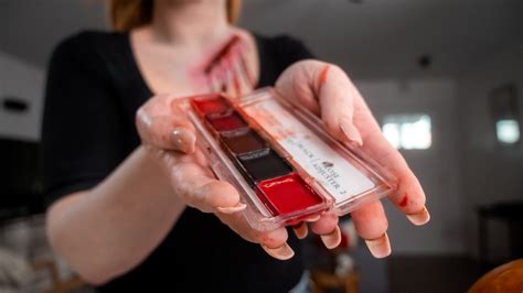 A hand with realistic-looking fake wounds and blood, as if it has been severed.