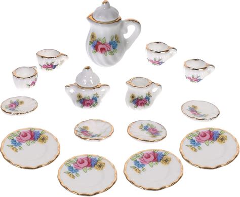 A collection of miniature doll accessories including handbags and tea sets.