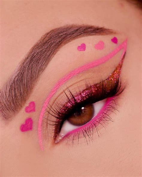 A collage of various Valentine's Day makeup looks, showcasing different styles from bold lips to intricate eye art.