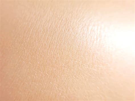 Close-up of smooth, clear skin texture, illustrating the effect on KP