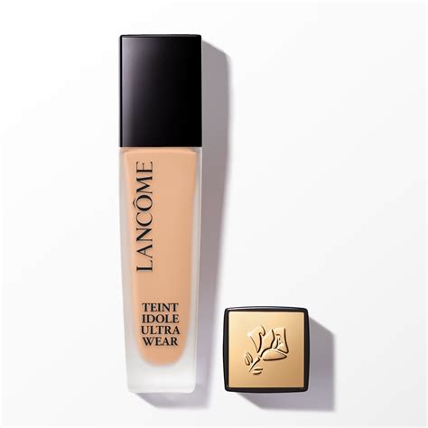 Aesthetic shot of the Lancôme Teint Idole Ultra Wear Foundation Stick, showcasing its sleek packaging and the integrated kabuki brush.