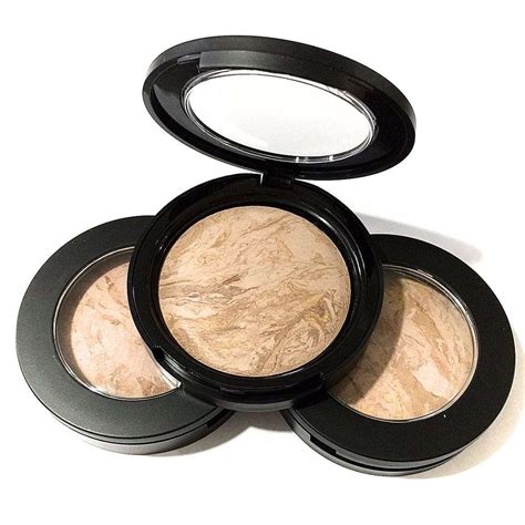 Close-up of a baked mineral foundation compact showing glistening veins of color
