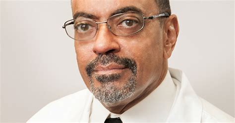 Portrait of Dr. Milton R. Moore, a professional and approachable dermatologist.