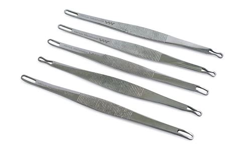 Illustration of different types of comedone extractors with various loop sizes and shapes.