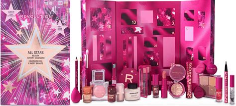 A close-up shot of an open Revolution Beauty advent calendar, revealing a selection of makeup and skincare products, with a focus on the variety and quality of the items.
