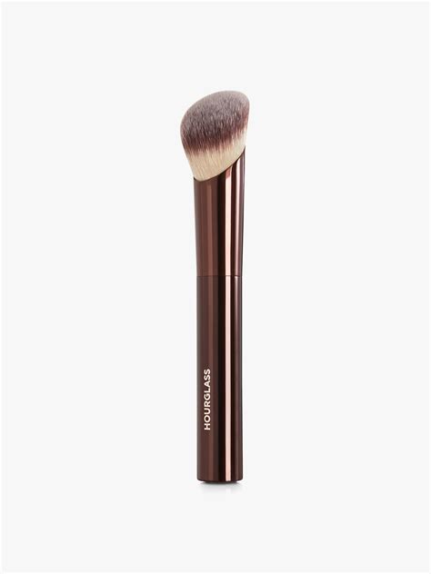 Close-up of the Hourglass Ambient Soft Glow Foundation Brush, highlighting its unique sloped bristle shape.