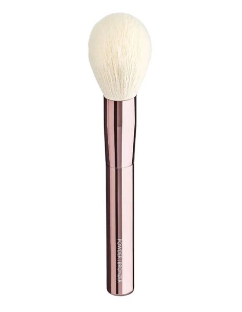 The Jenny Patinkin Sustainable Luxury Powder/Bronzer Brush, emphasizing its soft, dome-shaped head and eco-friendly construction.
