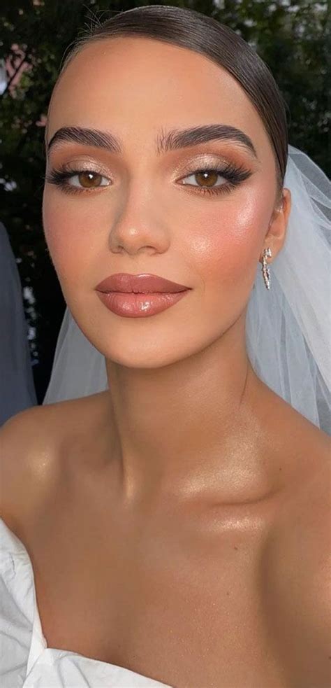 A bride with shimmery eyeshadow and a subtle glow.