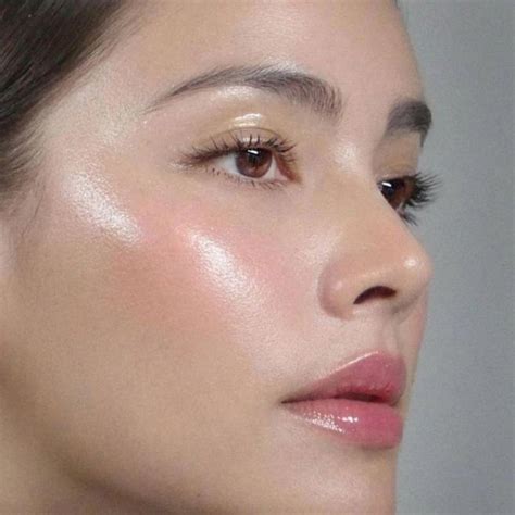 A bride with dewy skin and a soft pink blush.