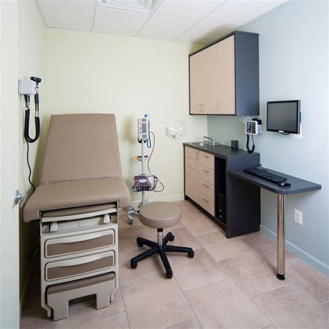 Interior view of a modern, well-equipped examination room at the Pleasant Hills dermatology office