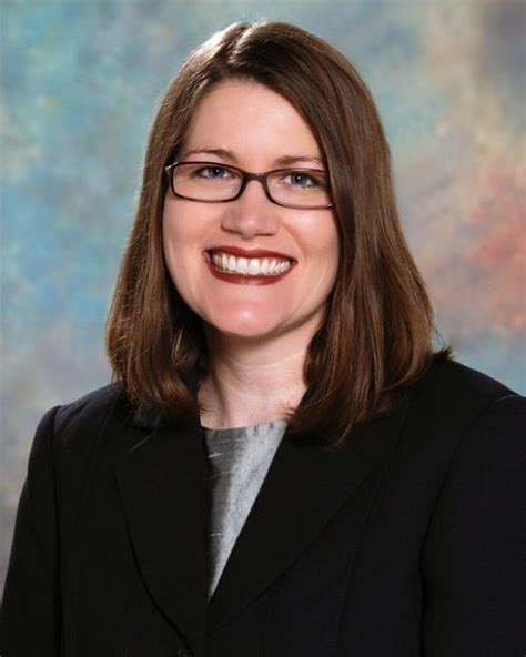 Photo of Dr. Rebecca Short in a professional setting.