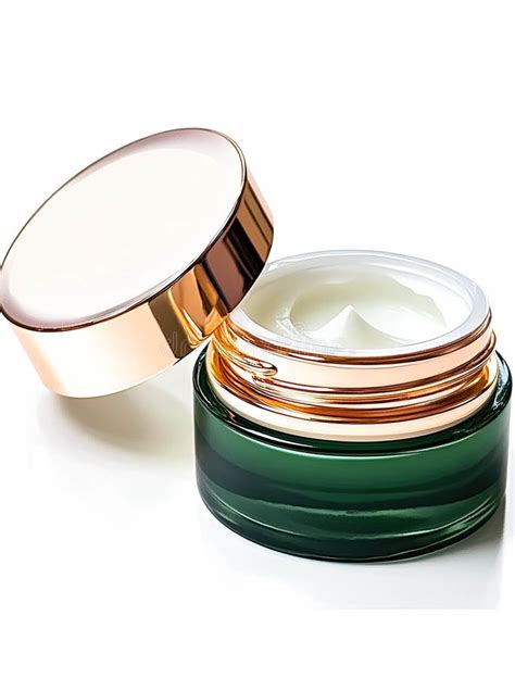 Image of a luxurious eye cream jar with a focus on its texture and applicator.