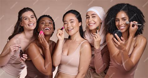 A diverse group of makeup artists applying setting powder with brushes, showcasing different skin tones and textures.