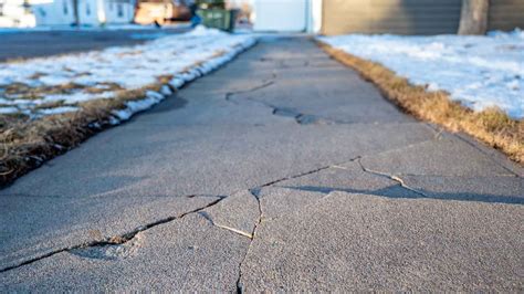 A collage featuring a figure mid-leap against a stark, ambiguous background, with a separate image of a crack in a sidewalk.