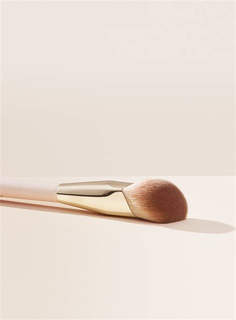 Close-up of the Rare Beauty Liquid Touch Foundation Brush, highlighting its angled shape