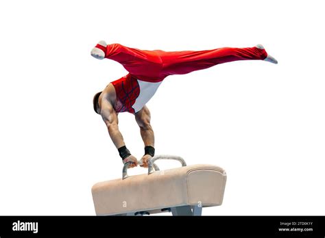 A male gymnast performing on the pommel horse, demonstrating intense focus and skill.
