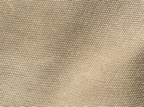 Close-up texture shot of waxed canvas fabric.